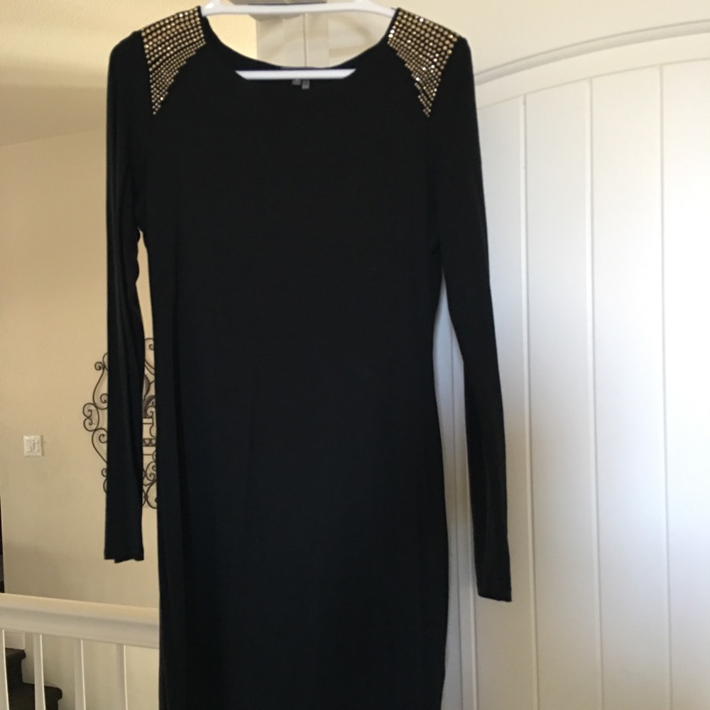 Jeweled long sleeve black dress.